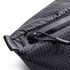 A close-up of a black, textured cooler bag featuring a zipper and a handle. It has a subtle diamond pattern.