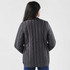 A quilted women's jacket in dark grey, featuring a fitted design and a logo on the back.