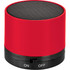 A red cylinder Bluetooth speaker with a black mesh top and a switch at the base. It features a logo on the body.