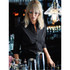 A black button-up women's shirt displayed on a model, with a bar setting and bottles in the background.