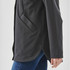 A black women's jacket with a side pocket, showcasing a modern cut and stylish finish.