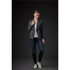 A women's Delano knit blazer in grey, paired with a light top and jeans, set against a dark background.