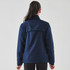 A navy women's rain jacket features a 1/4 zip design and gathered detailing on the shoulders, with a logo.