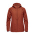 A women's wind jacket in a rust orange colour, featuring a hood and a zip closure, with a logo on it.