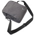 A grey shoulder bag with a shoulder strap and a logo, featuring a zippered compartment.