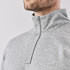 A men's grey pullover with a 1/4 zip collar, featuring a logo on the chest.