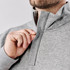 A grey men's pullover featuring a 1/4 zip collar and a brand logo.