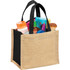 A jute gift tote bag in natural and black, filled with various cosmetic products and accessories.