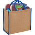 A large jute tote in natural colour with blue handles, filled with shoes, a drink bottle, a towel, and a book.