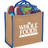 A large jute tote in natural and blue, filled with items like shoes, drinks, and a book, featuring a logo.