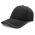 A black cap with a solid design and a sleek visor, featuring ventilation details and a logo.