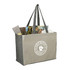 A grey recycled cotton tote bag with contrasting sides, featuring a logo and filled with magazines and a cosmetic product.