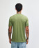 A green unisex T-shirt made from a tri-blend fabric, featuring a back view of the wearer.