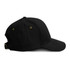 A black cap with a curved brim, featuring ventilation eyelets and an adjustable strap at the back.