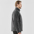 A grey Men's Athabasca Thermal Jacket displayed on a male model, featuring a collar and a logo.