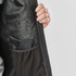 A men's thermal jacket featuring a grey interior, a pocket, and a logo on the label inside.