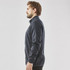 A men's full zip fleece jacket in dark navy, featuring a high collar and side pockets. It has a simple logo design.