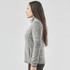 A women's full zip fleece jacket in grey, featuring a high collar and side pockets, with a logo.
