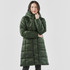 A long, green puffer jacket featuring a hood and a quilted design, presented on a model.