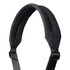 A padded black shoulder strap with an adjustable buckle and a logo at the top.
