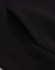 A close-up of a black unisex premium fleece oversized hoodie, highlighting the fabric texture and stitching details.