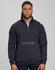 A unisex premium fleece half zip work sweat in navy blue, featuring a zip pocket and a logo on the sleeve.