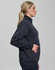 A woman in a side profile wearing a dark grey unisex premium fleece half zip sweatshirt, featuring a pocket.