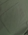 A close-up of a green cotton blend fabric featuring a stitched pocket.