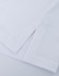 A close-up of a white ultrafine cotton pique polo, featuring textured fabric and neatly folded hems.