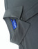 A grey men's polo featuring a collar and a button closure, displaying a tag with a logo.