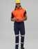 A man wearing a high-visibility orange polo shirt and navy work pants with reflective tape, along with a yellow hard hat.