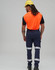 Flexi work pants in navy with reflective tapes, worn by a person in an orange shirt and yellow hard hat.