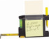 A black combo tape measure with a level, pen holder, and sticky note pad; yellow measuring tape extending from the side.