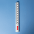 A white popper ruler featuring multiple poppers along its length and a small logo.