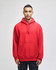 A red pullover hooded sweatshirt with a front pocket and a logo on the sleeve.