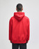 A red pullover hooded sweatshirt featuring a logo, viewed from the back.