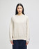 A light beige adult crew sweatshirt, featuring long sleeves and a subtle logo, displayed on a model.