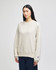 A light grey Champion Reverse Weave® adult crew sweatshirt displayed on a model. It has a logo on the sleeve.