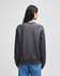 A dark grey adult crew sweatshirt with a relaxed fit, featuring a logo on the back.