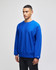 A blue Champion Reverse Weave® adult crew sweatshirt on a model, featuring a logo on the sleeve.