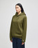 A green hooded sweatshirt with a front pocket and a logo on the sleeve, displayed on a model.