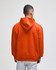 An orange pullover hooded sweatshirt viewed from the back, featuring a spacious hood and relaxed fit.