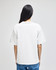 A plain white adult t-shirt, shown from the back, features a relaxed fit and a simple design.
