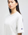 A light grey t-shirt displayed on a model, featuring a logo on the sleeve. Simple and classic design.
