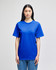 A blue adult short-sleeve t-shirt on a model, featuring a relaxed fit and a simple design.