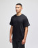 A black Champion adult short-sleeve t-shirt featuring a small logo on the sleeve.