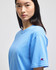 A blue short-sleeve t-shirt featuring a logo on the sleeve.