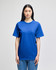 A blue short-sleeve t-shirt displayed on a model, featuring a relaxed fit and plain design.