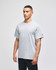 A grey short-sleeve t-shirt featuring a logo, displayed on a model against a neutral background.