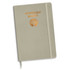 A light grey notebook with a foil printed design and an emblem. It features a binding and an elastic closure.